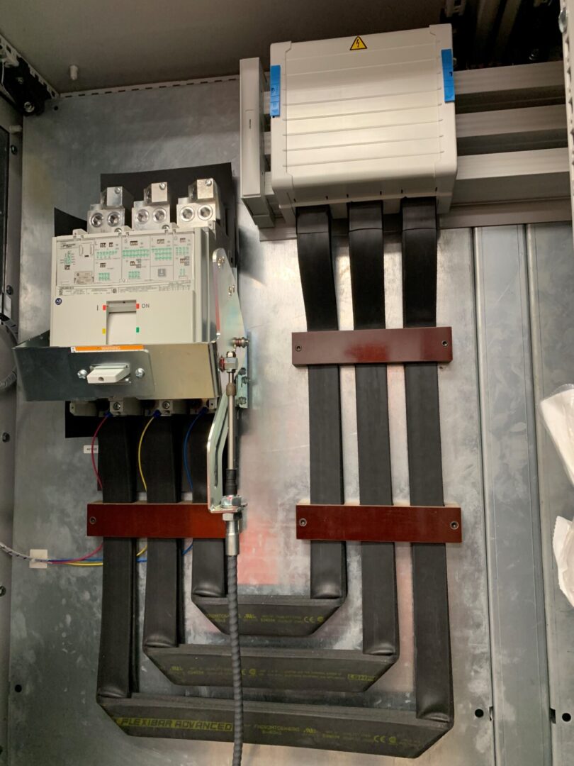 A view of an electrical panel with some wires.